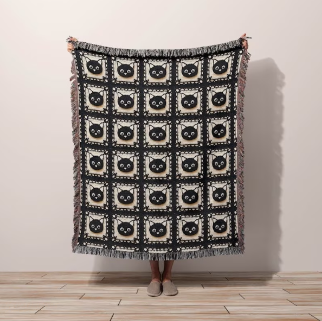 Handmade throw blanket woven from natural cotton, ideal for cat lovers.