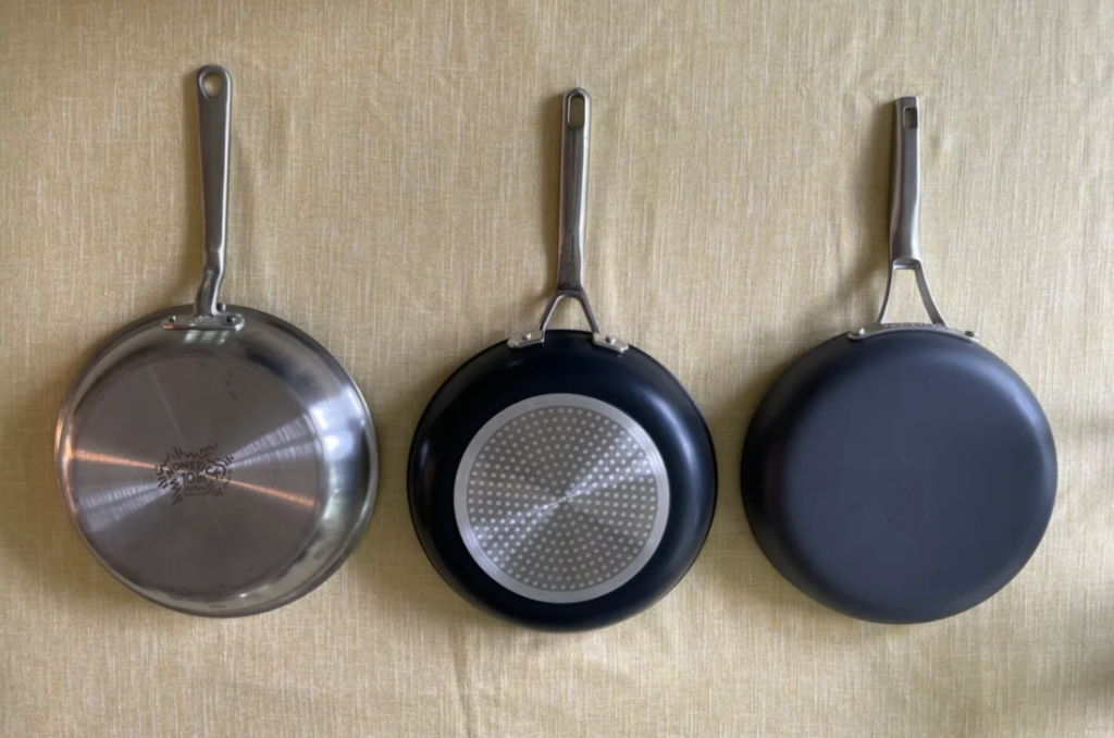 Nonstick pan with raised stainless steel pattern - resists metal utensil damage.