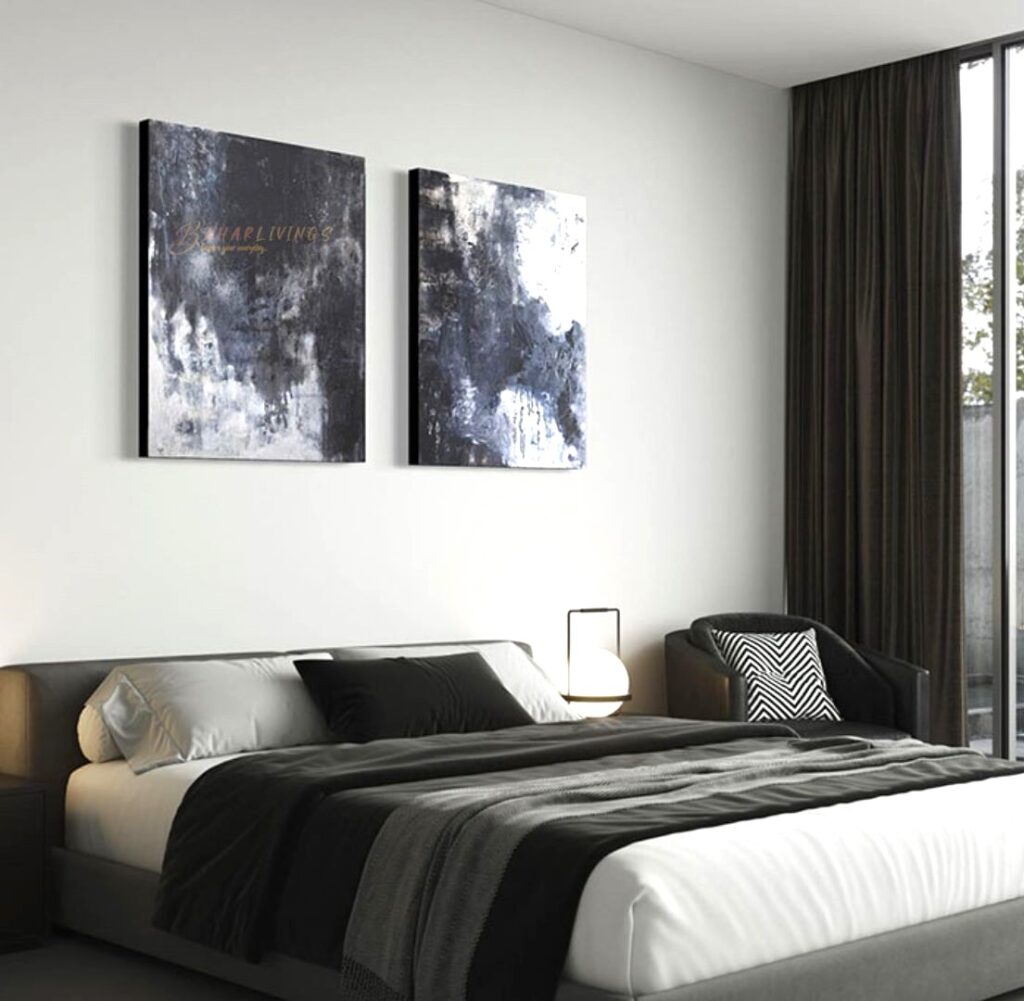 Dark bedroom with standout pieces of art and bed 