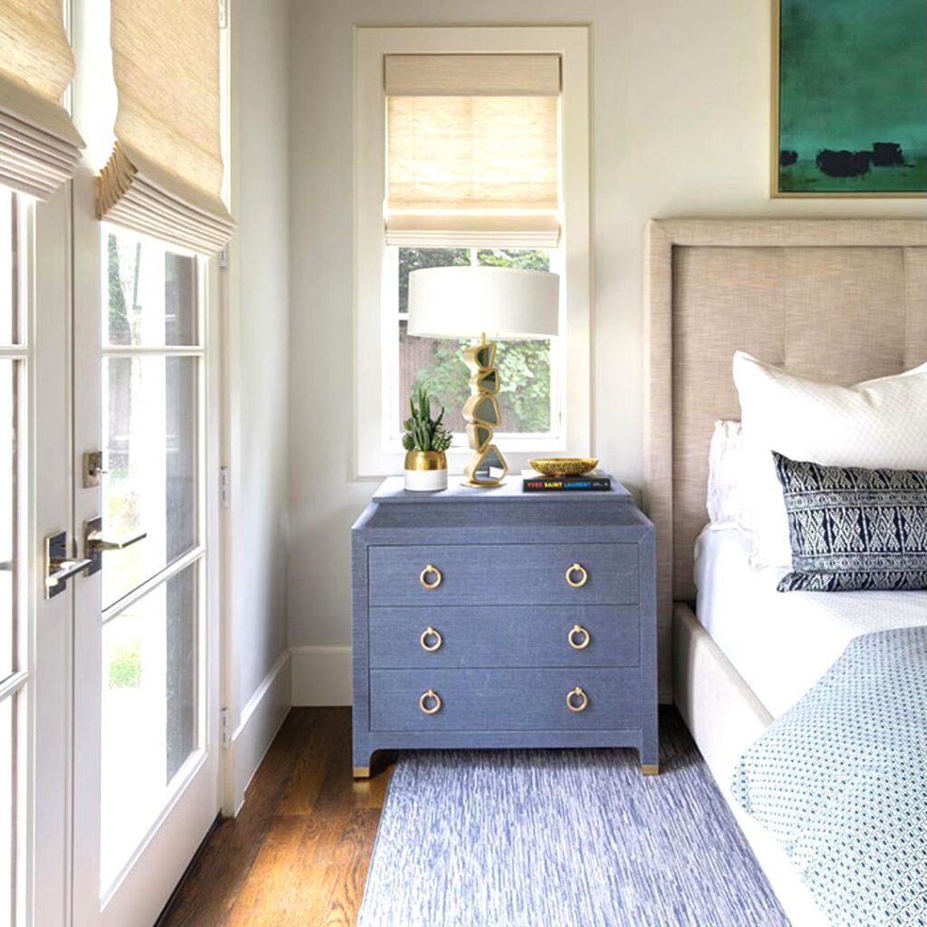 Blue nightstand near a bed in a bedroom